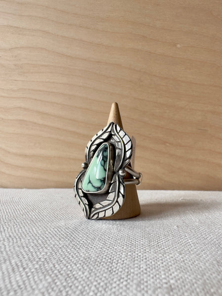 triangular turquoise ring with a wavy feather sterling silver casting