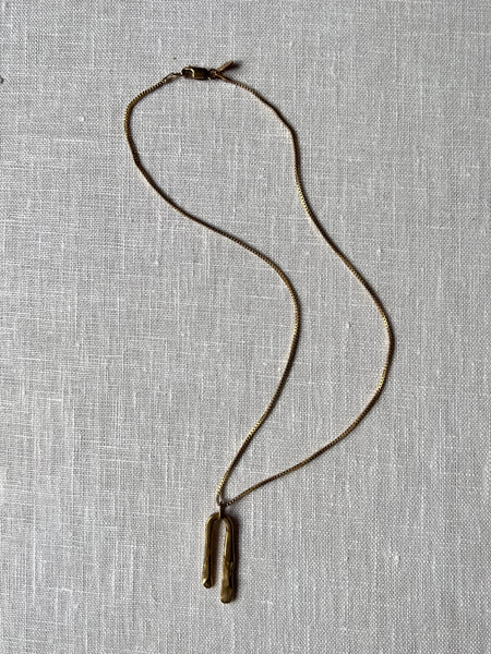 Brass Horseshoe shaped pendant on a brass box chain