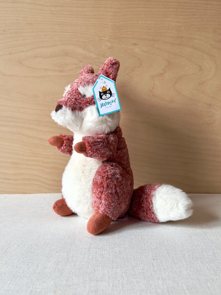 Small red and white stuffed fox