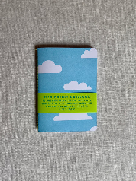 Blue notebook with white clouds