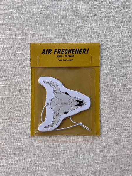 Beige air freshener shaped like a cow skull