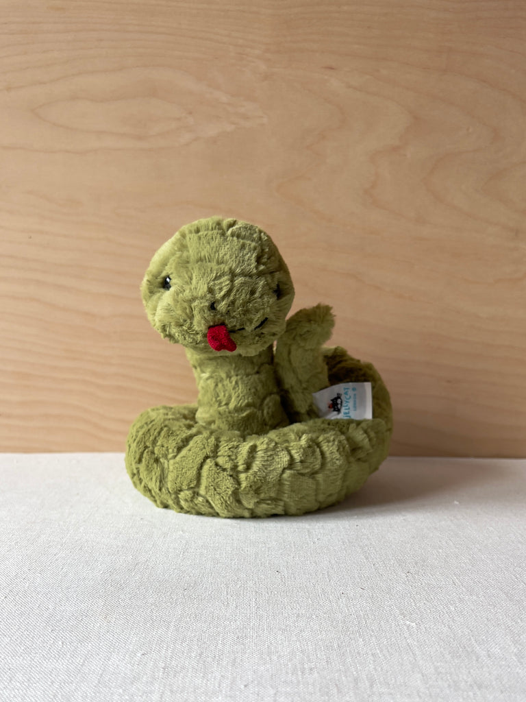 Small green coiled snake plushie with a red tongue