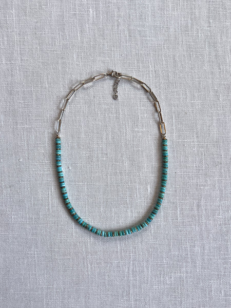 medium length necklace with paperclip sterling chain link on half of the necklace and turquoise beads on the other half.