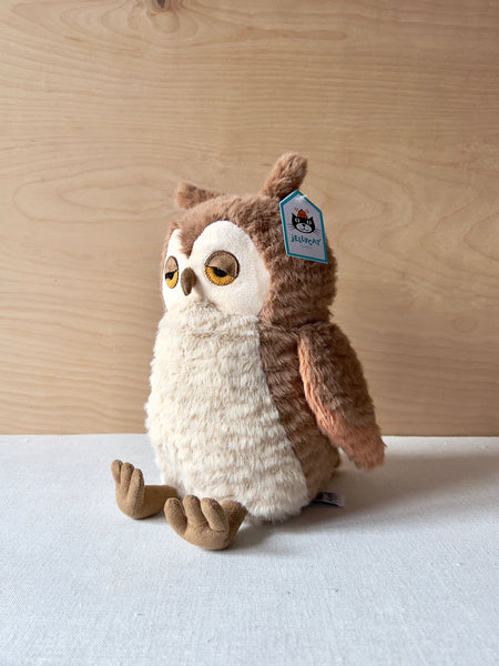 White and brown stuffed owl with sleepy eyes