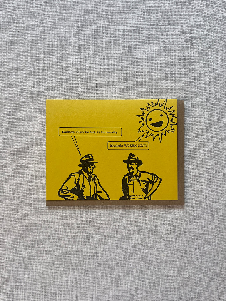 Yellow Card with two men talking under a smiling sun. The left most man has a speech bubble reading "you know, its not the heat, its the humidity." The smiling sun has a speech bubble reading "It's also the FUCKING HEAT."
