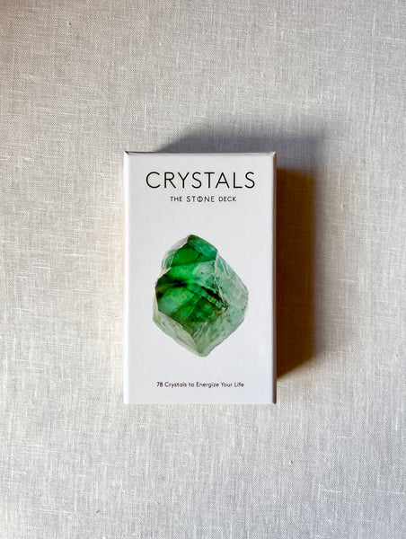 White Paper box with art of a green stone on the front and black text that reads "Crystals The Stone Deck: 70 Crystals to Energize Your Life."
