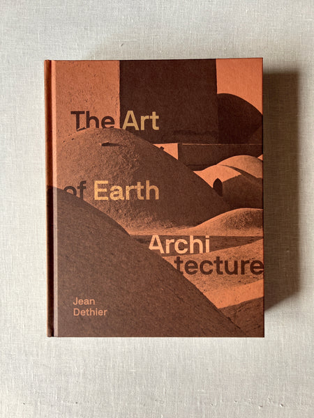 Brown cover of the book "The Art of Earth Architecture" by Jean Dethier showing different shapes