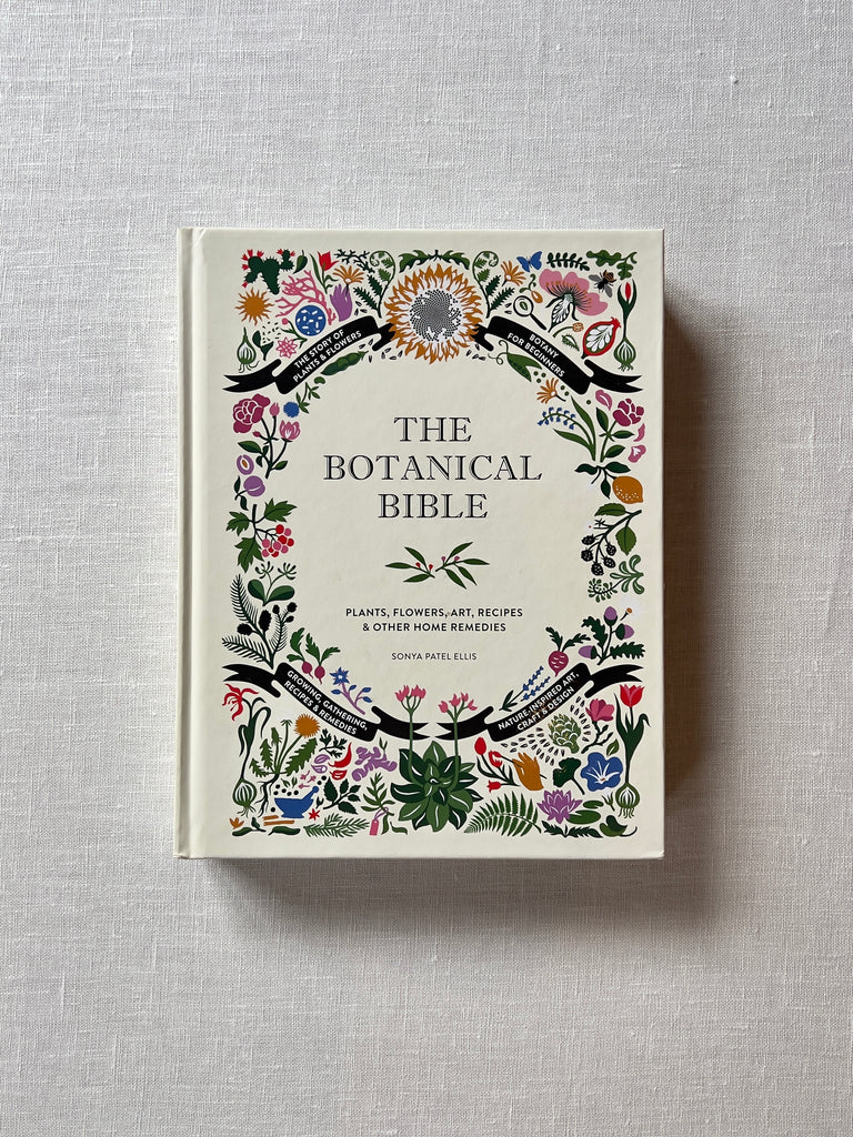 A cover of the book :The Botanical Bible" by Sonya Patel Ellis. The cover has various illustrations of flowers, herbs and apothecary items. Additional text reads "Plants, Flowers, Art, Recipes & Other Home Remedies." "Growing, Gathering, Recipes & Remedies. Nature-Inspired Art, Craft & Design." 