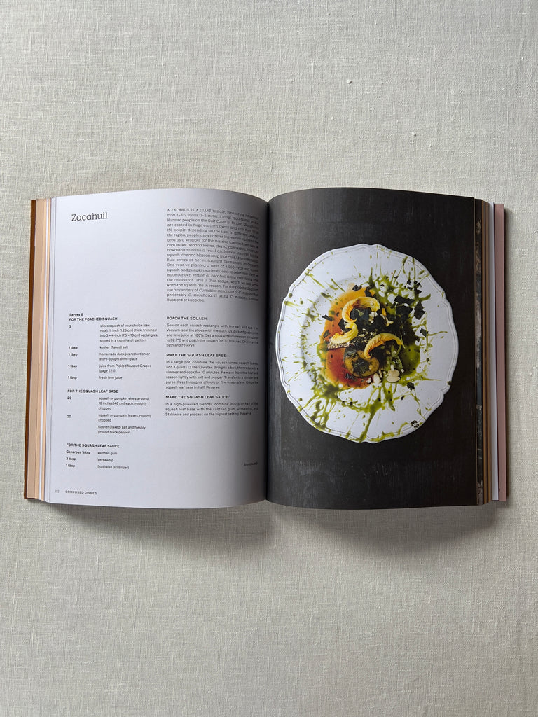 The book "Cooking In Marfa" opened to a page showcasing a veggie dish.