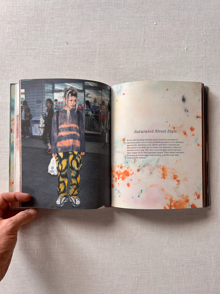 The book "Tie Dye" opened to a page showing someone in street fashion