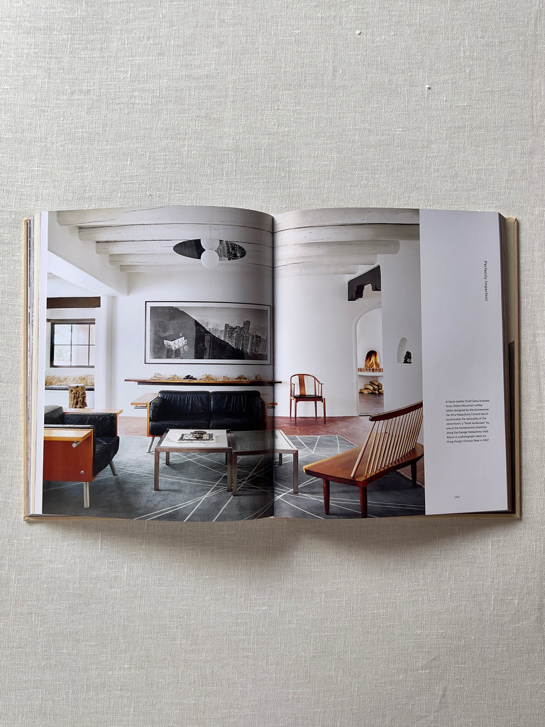The book "Santa Fe Modern" opened to a page showcasing a modern style living room.