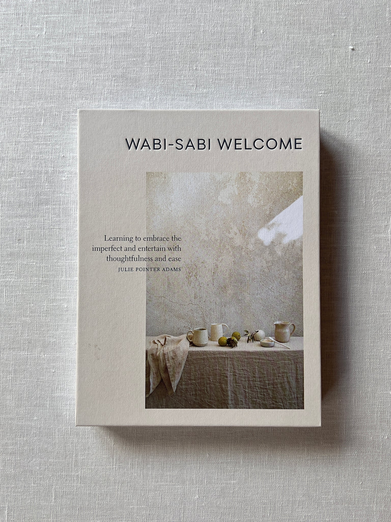 White cover of the book "Wabi-Sabi Welcome" by julie pointer adams