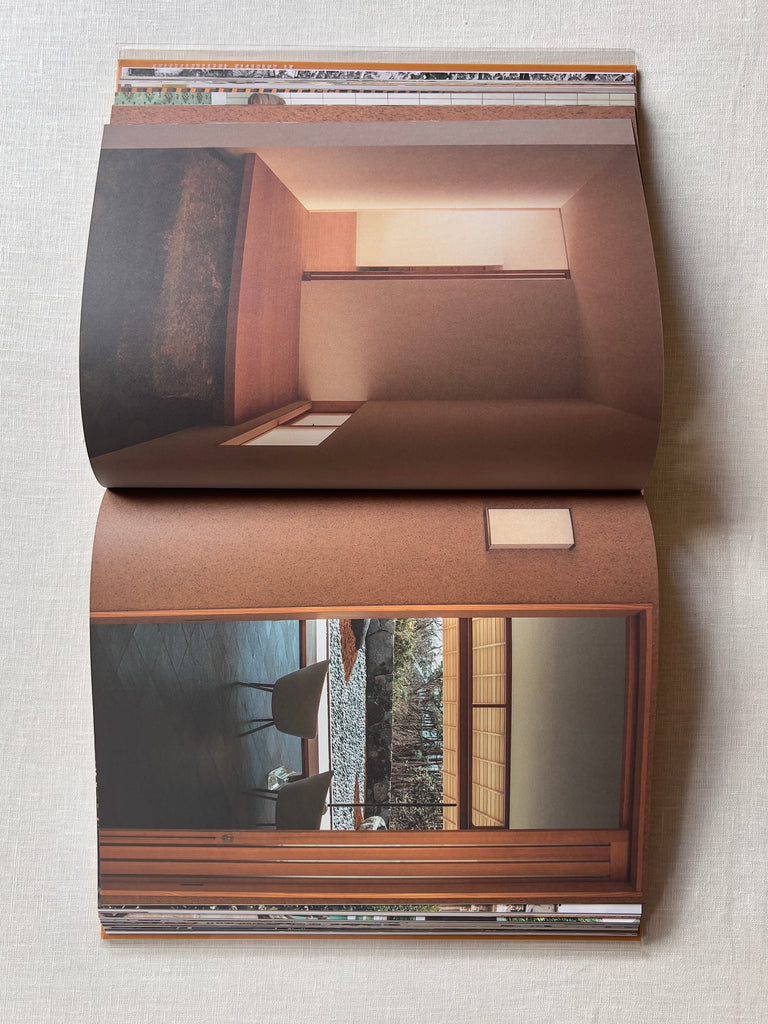 The book "Interior Voyages" opened to a page showing views of two different rooms.