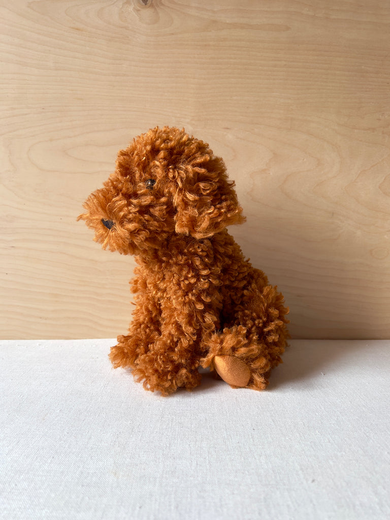 Stuffed animal resembling a golden doodle
