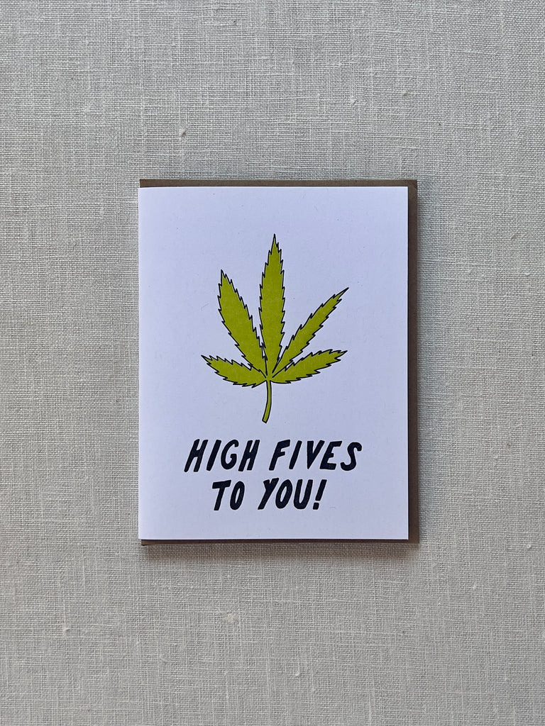 White card with a a weed leaf in the middle and black text under it reading "High Fives to You"