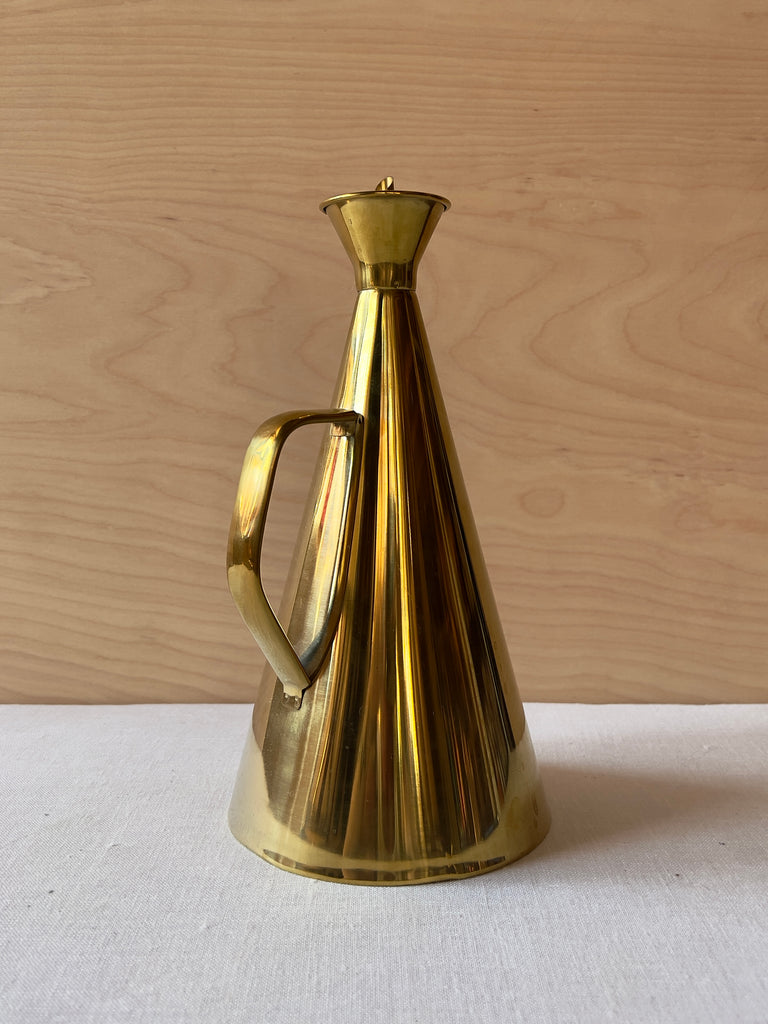 Large bronze oil cruet with an hourglass shape and handle
