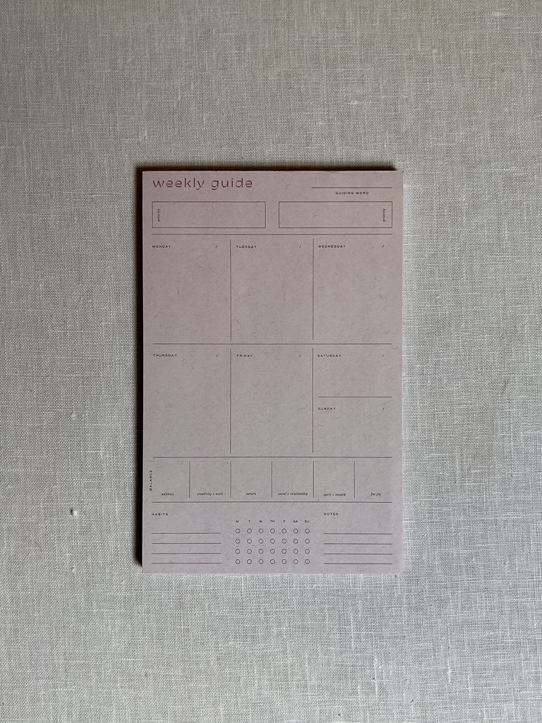 White Week calendar with the text "weekly guide" at the top left