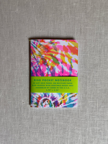 Tie dye print notebook with the colors purple, pink, orange, green, blue and yellow