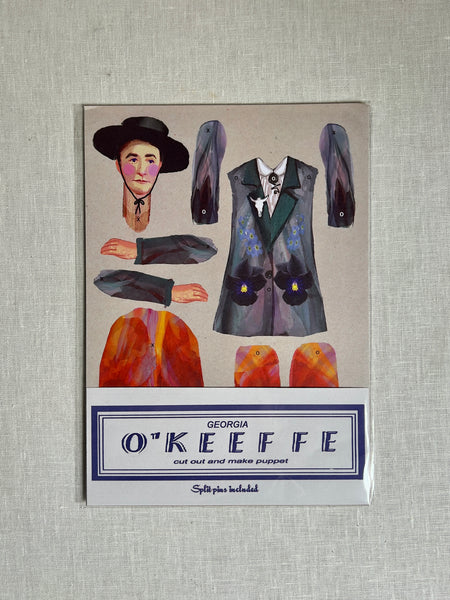 paper doll of georgia o'keeffe wearing a black hat and a black blazer