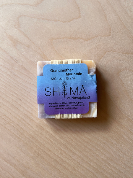 White and purple square soap with black text reading "Blue Corn" "shima of navajoland"