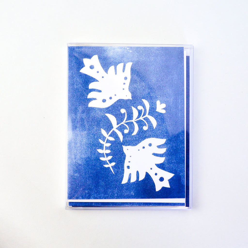 Blue card with white doves and an olive leaf.