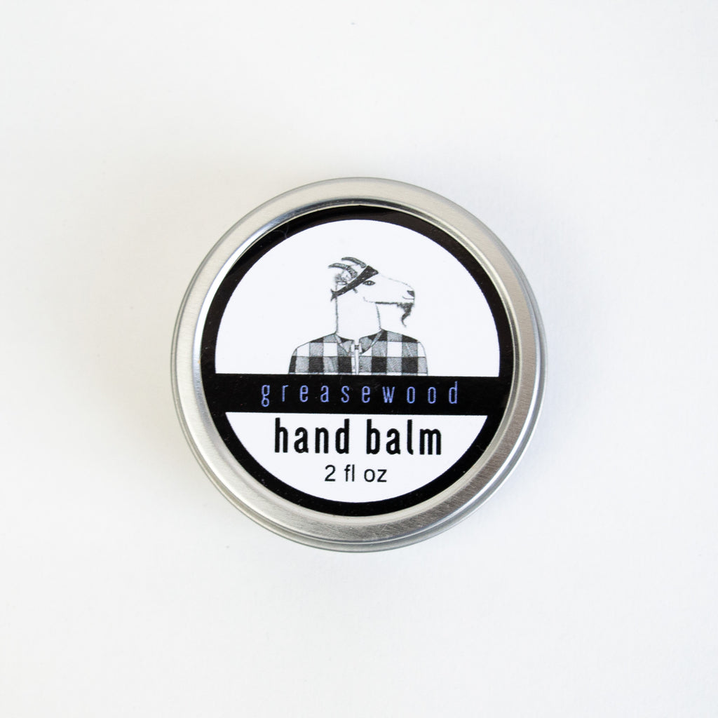 Hand balm in a circular aluminum container. the container is labelled "greasewood" 