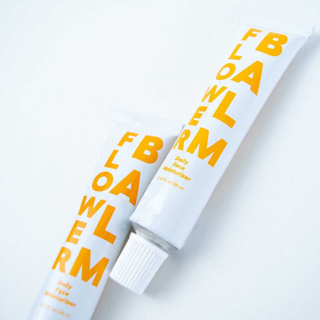 A tube of body balm called flower balm. It has rosehip oil, squalane and a blend of 11 leaves and flowers.