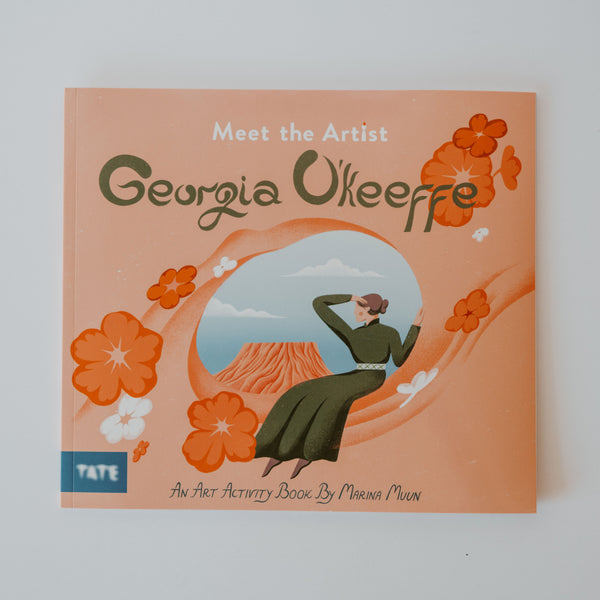 Cover of the book "Meet the Artist Georgia O'Keeffe" by Marina Muun. The cover showcases a woman in a green dress looking out to a pink plateau. Additional text reads "An Art Activity Book."