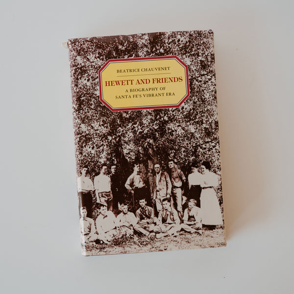 A cover of the book "Hewett and Friends A Biography of Santa Fe's Vibrant Era" by Beatrice Chauvenet. The cover is an old black and white photograph of a family posing in front of trees.