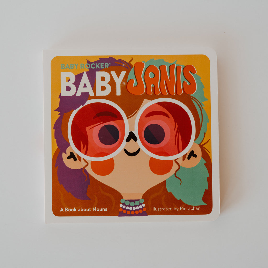 A cover of the book "Baby Rocker: Baby Janis." Ilustrated by Pintachan. The cover is an illustrated image of baby Janis Joplin. Additional text reads "A Book about Nouns."