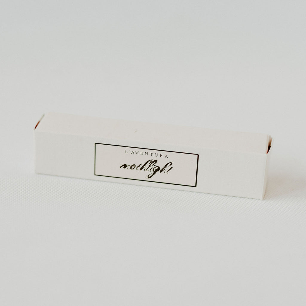 Small rectangular cardboard box with a label reading "Mothlight."