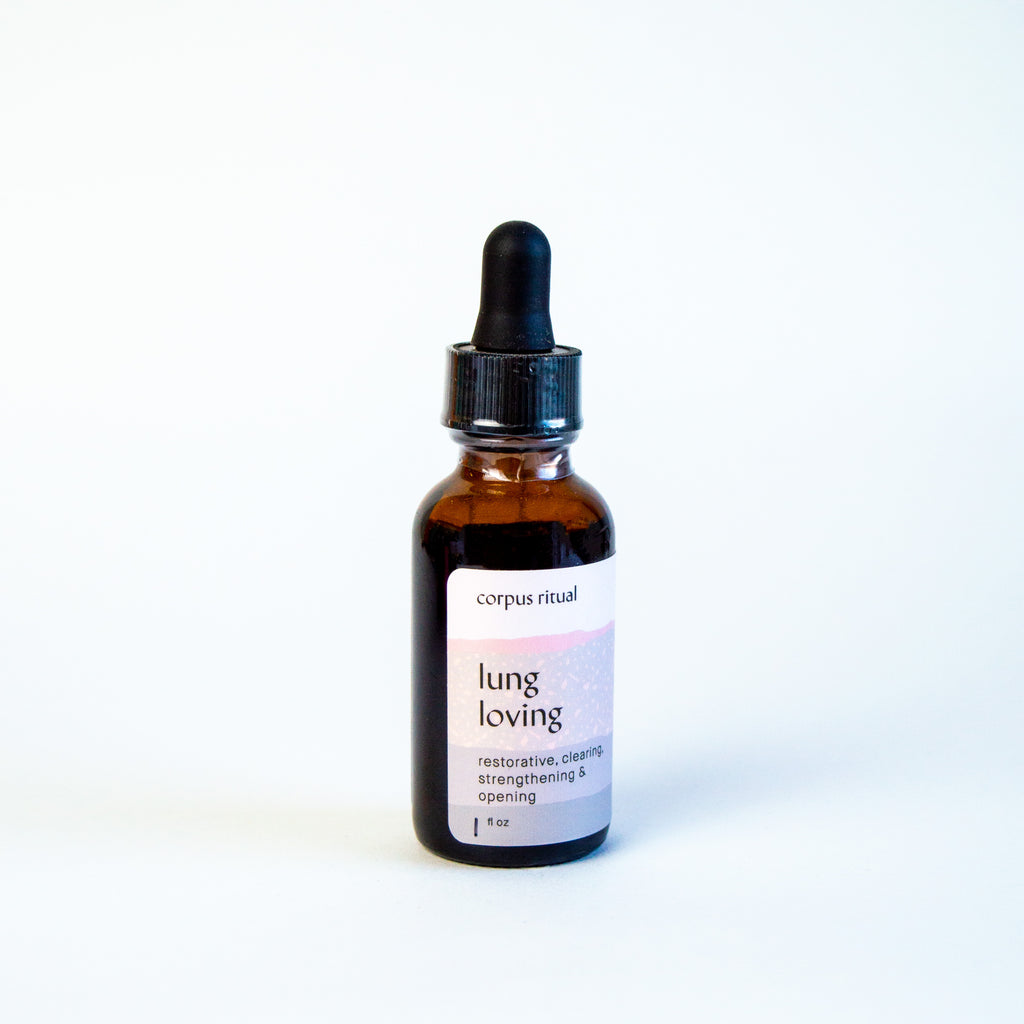 Amber glass dropper bottle with a white label and black text reading "Lung Loving."