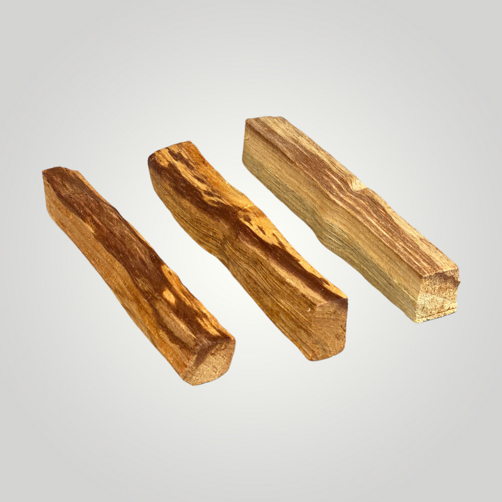Three small sticks of palo santo wood.
