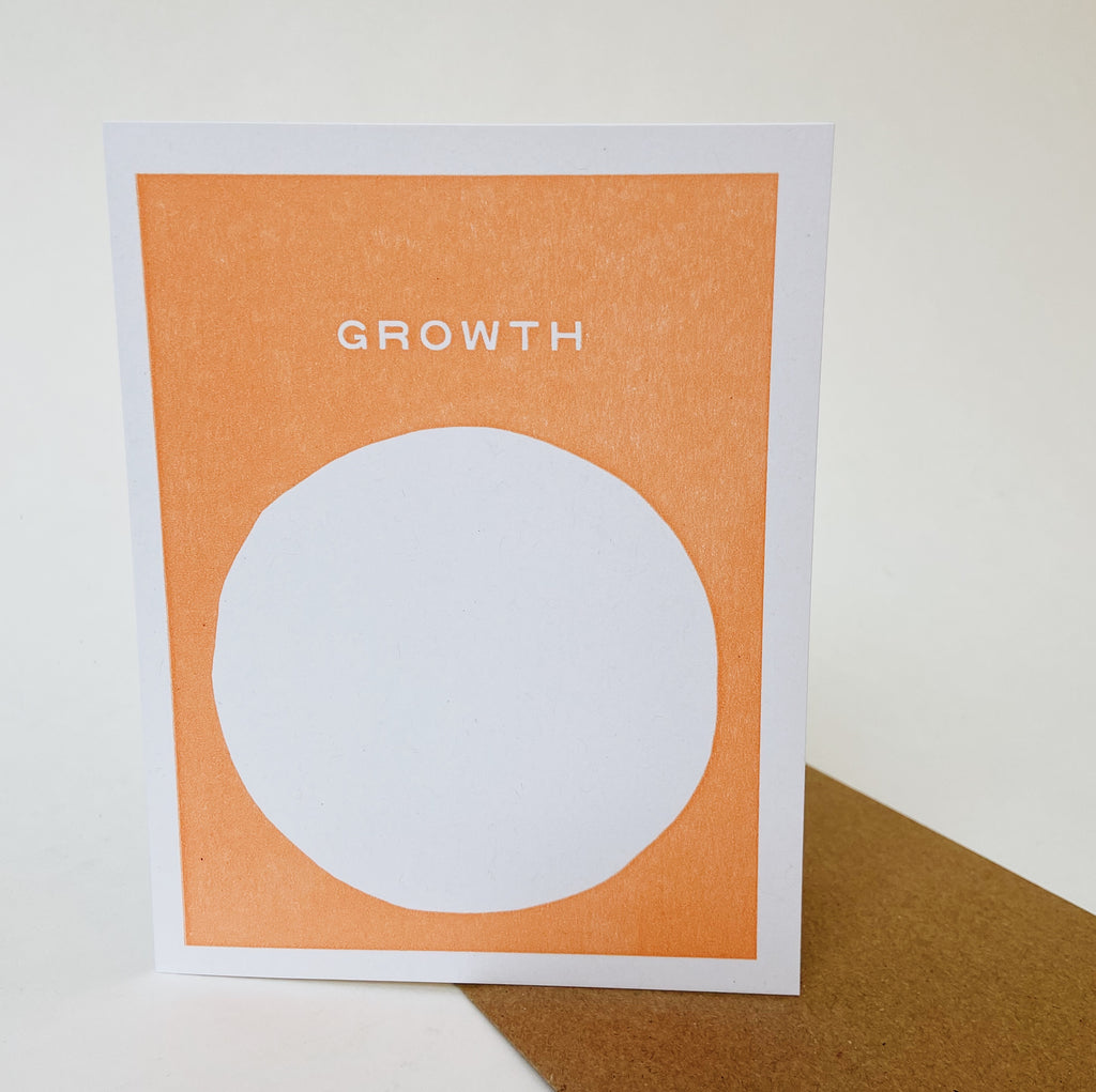 Orange card with a white circle in the middle and white lettering near the top reading "growth."